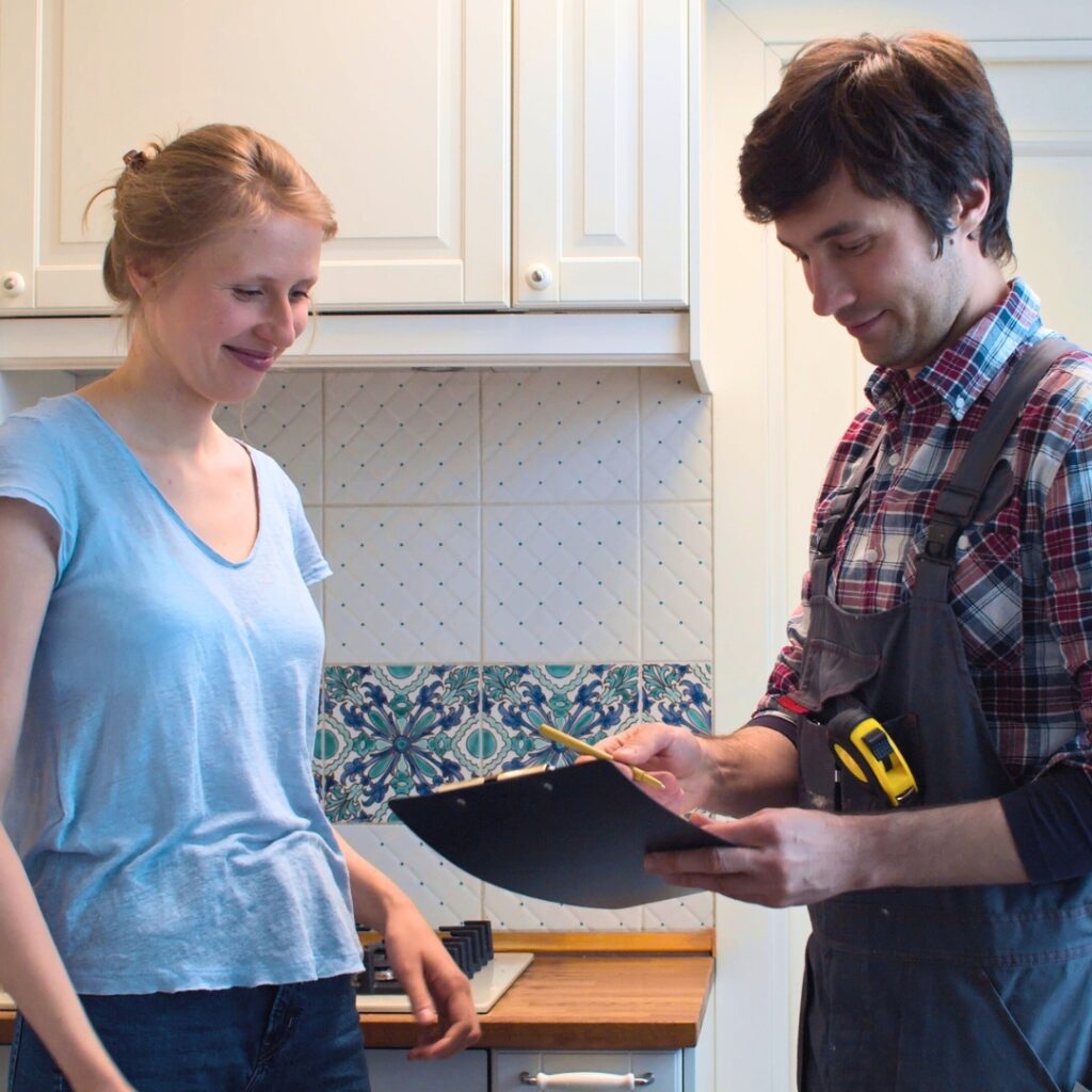 plumber helping woman with documents